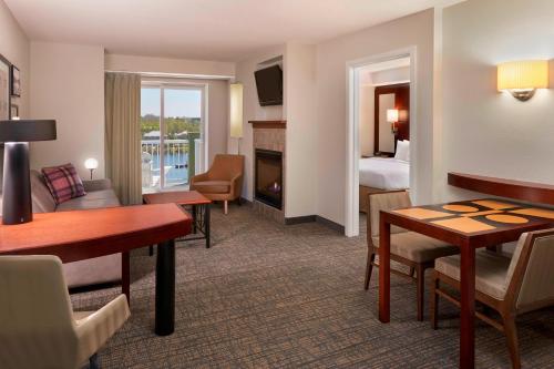 a hotel room with a living room and a bedroom at Residence Inn by Marriott Gravenhurst Muskoka Wharf in Gravenhurst