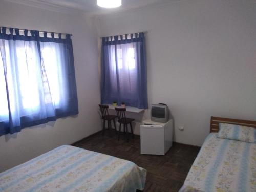 Ένα ή περισσότερα κρεβάτια σε δωμάτιο στο Apt Hotel Sitio Do Carmo