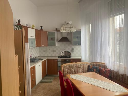 a kitchen with a table and a dining room at Apartment La Mar in Pula
