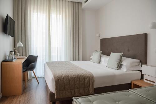 Postel nebo postele na pokoji v ubytování Hotel Select Suites & Spa - Apartments