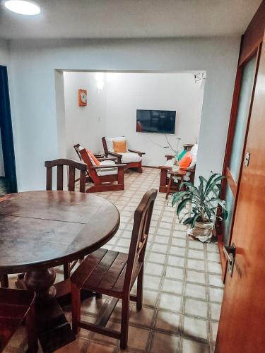 a living room with a table and chairs and a couch at Departamento DERQUI en la mejor zona de NVA CBA in Cordoba