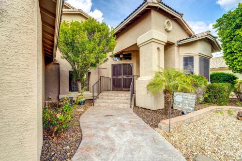 a house with a walkway in front of it at Peoria Vacation Rental with Pool and Hot Tub! in Peoria