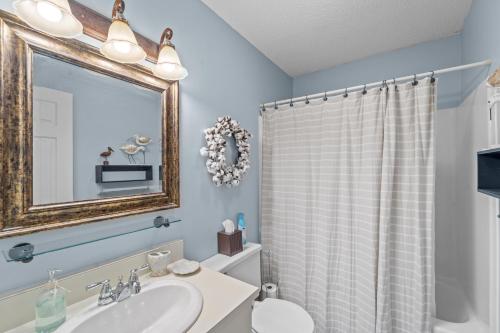 a bathroom with a sink and a shower curtain at High View in Avon