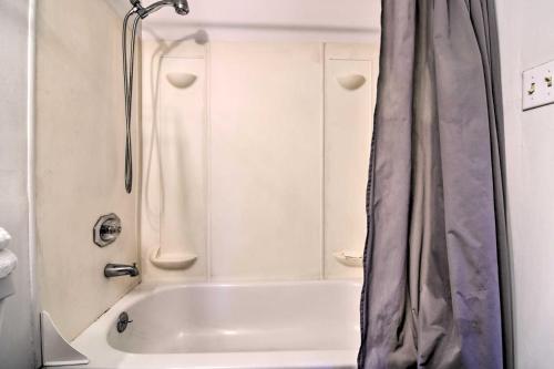 a bathroom with a shower and a white tub at Vacation Rental in Loveland 1 Mi to Downtown! in Loveland