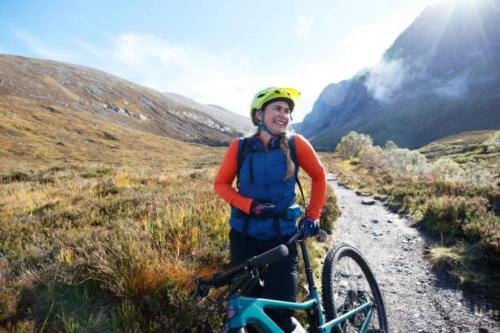 a man standing next to a bike on a trail at The Stables in Pitlochry