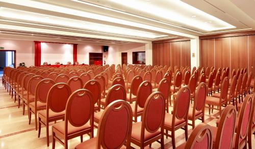 a room full of chairs in a conference room at Hotel Aktea in Lipari