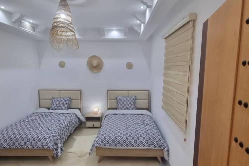 Postel nebo postele na pokoji v ubytování Villa des Lotophages