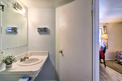 a bathroom with a sink and a mirror at Pet-Friendly Vacation Rental Near Boyd Lake in Loveland
