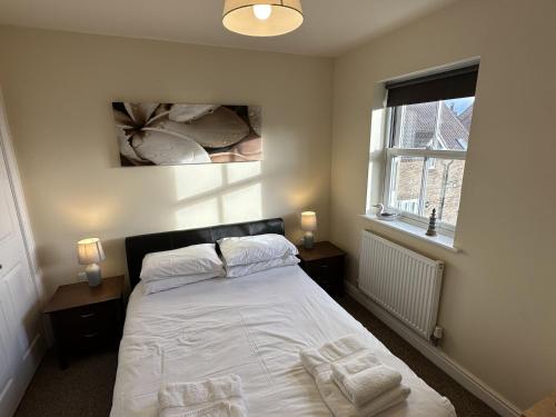 En eller flere senge i et værelse på Coral Shores