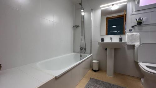 a bathroom with a tub and a sink and a toilet at Apartment in Mar Menor Golf Resort in Torre-Pacheco