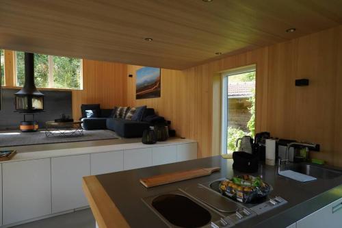 a kitchen with a sink and a stove top oven at NEU: Alpen-Chalet Seekarblick mit Pool in Lenggries