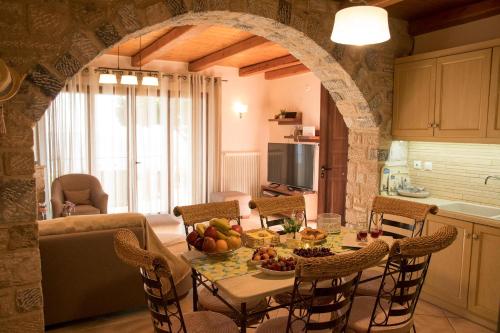 a kitchen with a table with a bowl of fruit on it at IRIDA in Koilás