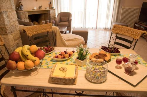 a table with fruits and vegetables on top of it at IRIDA in Koilás