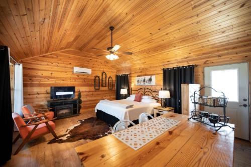 a bedroom with a bed and a wooden ceiling at City on a Hill at Spring Creek in Fredericksburg