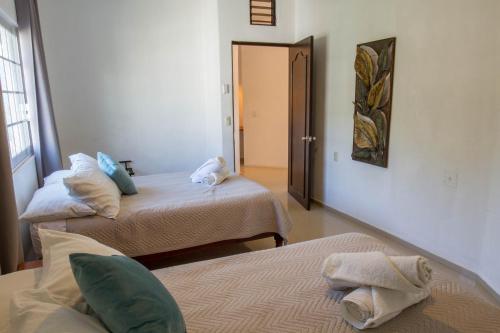 Ένα ή περισσότερα κρεβάτια σε δωμάτιο στο Villas Pura Chacala
