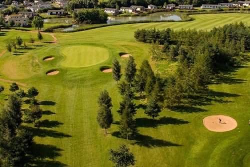 an overhead view of a golf course with trees at Lakeview Lodge in Wisbech