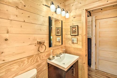 a bathroom with a sink and a mirror at Pet-Friendly Santee River Retreat with Private Dock! in Georgetown