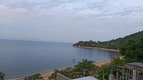 a view of a body of water with trees at CALAO Kep Residence Hotel in Kep