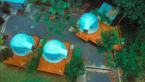 an overhead view of three domes in a park at Heaven Hill Camping in Ban Thung Na