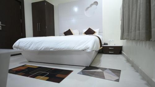 Katil atau katil-katil dalam bilik di Hotel Green Apple