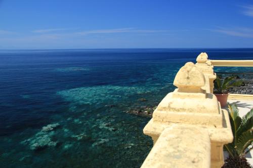 a view of the ocean from a building at Hotel L'Ariana ISOLE EOLIE - UNA Esperienze in Leni
