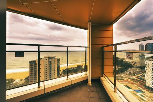 a balcony with a view of the beach and the ocean at Kwangsu Hotel Haeundae in Busan
