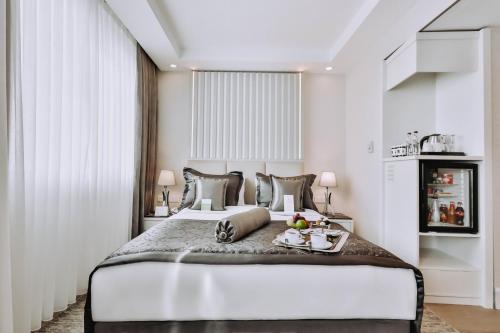 Ένα ή περισσότερα κρεβάτια σε δωμάτιο στο New Park Hotel