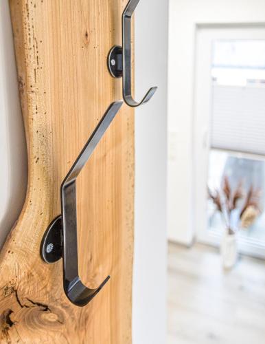 ajar door handle on a wooden door with a window at Weisses Rössl in Pfreimd