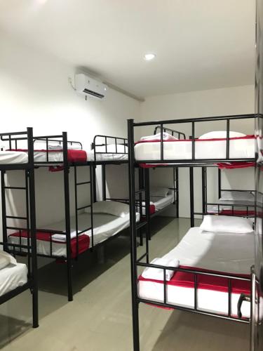 a group of bunk beds in a room at Yayah Hostel in Bogor