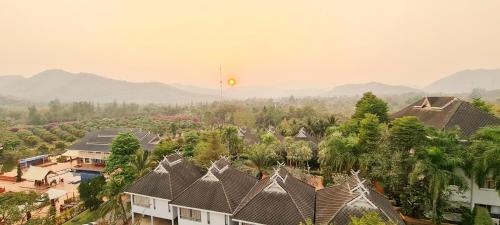 an aerial view of a village with houses and trees at Phu Pha Phung Resort in Suan Phung