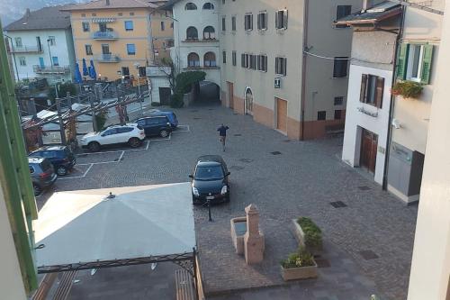 an aerial view of a parking lot with a car at Casi di Lisi, la luce sulla piazza e sulle montagne in Lisignago