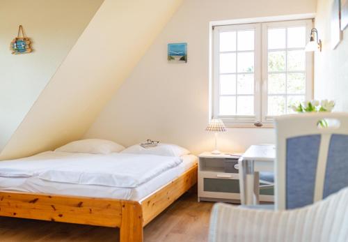 Postel nebo postele na pokoji v ubytování Wattstübchen (Haus Pesel)