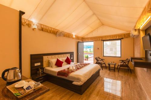 a bedroom with a large bed in a room at Zostel Homes Pushkar in Pushkar