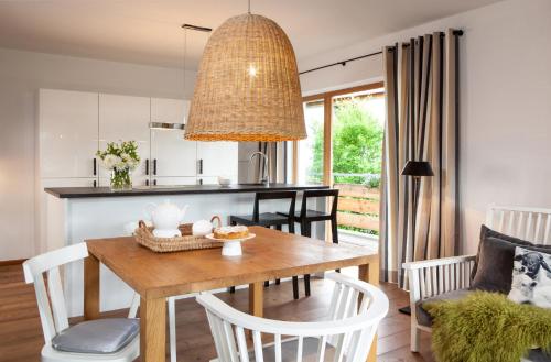 a kitchen and dining room with a table and chairs at Bergesgrün in Oberstdorf