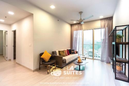 a living room with a couch and a chair at Windmill Upon Hills Premium Suites Genting Highland in Genting Highlands