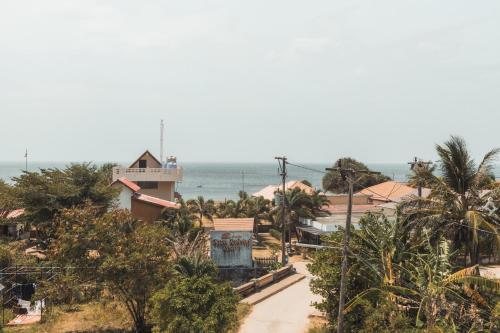 a resort with the ocean in the background at Lanta Ray Bay Hotel in Ko Lanta