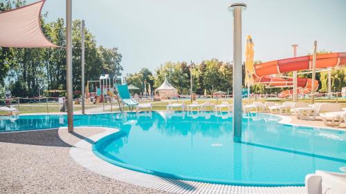 a pool at a resort with a water park at Wellness Hotel Patince in Patince