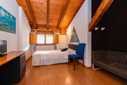 Postel nebo postele na pokoji v ubytování Hotel New Genziana