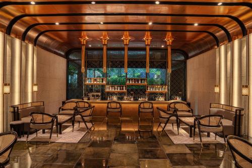 a rendering of a restaurant with chairs and a bar at The RuMa Hotel and Residences in Kuala Lumpur