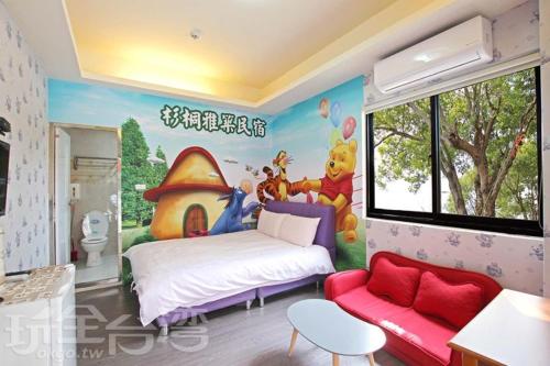 a bedroom with a mickey mouse mural on the wall at Miaoli Sanyi Shantongyazhu Homestay in Sanyi