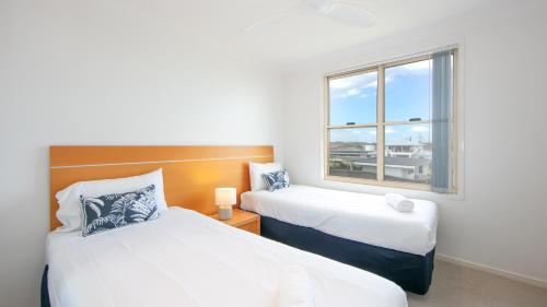 The Sands Resort at Yambaにあるベッド