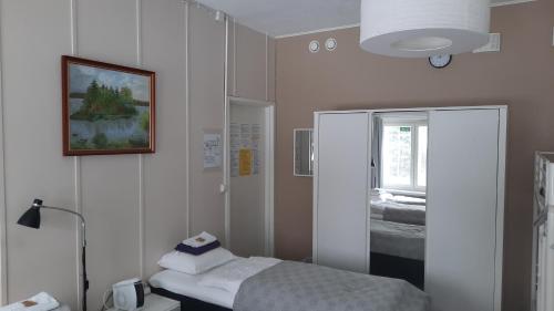 a hospital room with a bed and a window at Imatran Portti in Imatra