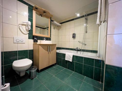 Vannituba majutusasutuses Wellness Apart Hotel