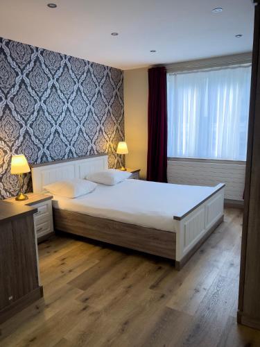 Voodi või voodid majutusasutuse Wellness Apart Hotel toas