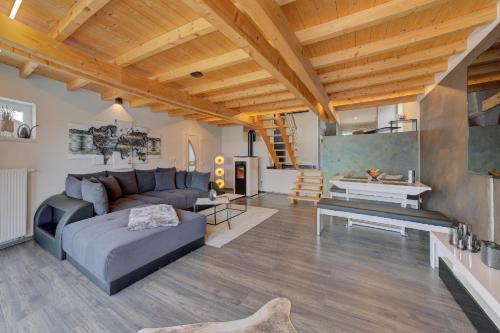 a living room with a couch and a table at Chalet Young & Fun in Freyung