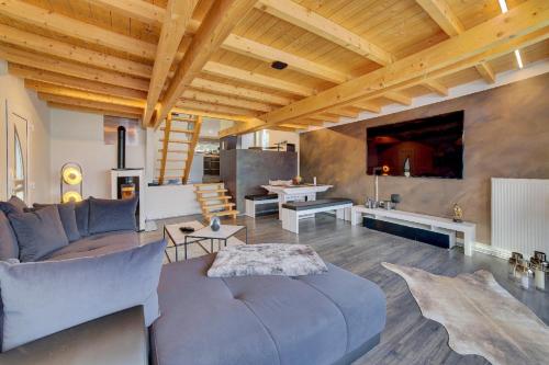 a living room with a couch and a table at Chalet Young & Fun in Freyung