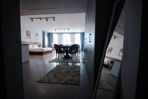 a dining room with a table and chairs in a room at El Gouna Elite Worldwide Sea & Garden Residences - Hurghada, Egypt in Hurghada
