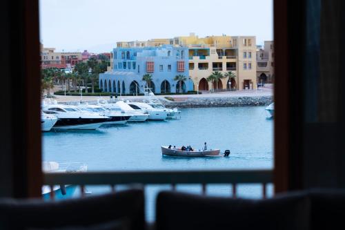 a group of people in a boat in a marina at El Gouna Elite Worldwide Sea & Garden Residences - Hurghada, Egypt in Hurghada