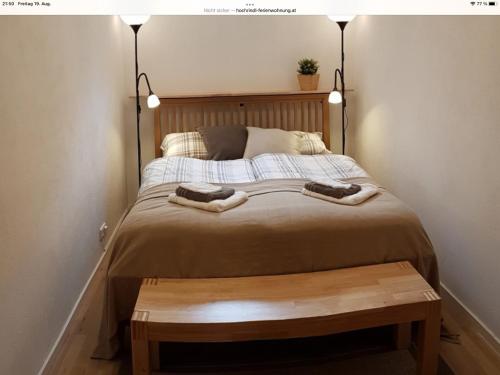 a bedroom with a bed with two towels on it at Haus Weitblick in Sirnitz-Sonnseite