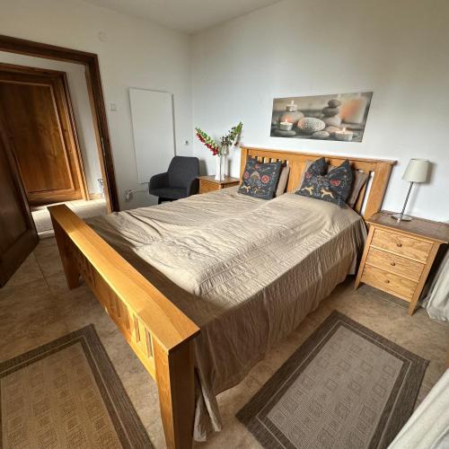 a bedroom with a large bed in a room at Haus Weitblick in Sirnitz-Sonnseite